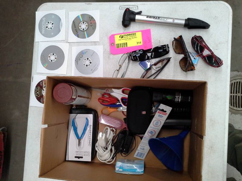 lot 314 image: Scissors, Axe Body Spray, Power Cords, Toolbrush, Hair Brush, Funnel, Music CDs