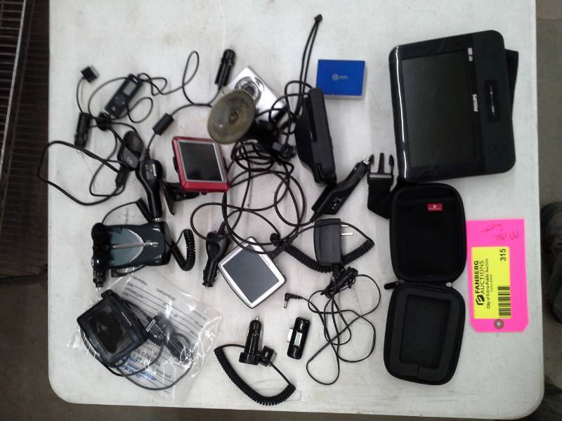lot 315 image: Philips Portable DVD Player, Garmin Nuvi, Jensen, POM, Cobra Scanner, Car Power Cords and Accessories