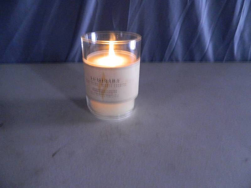 lot 23 image: Genuine Luminara Real Flame Effect Chardonnat Scented Candle with Remote