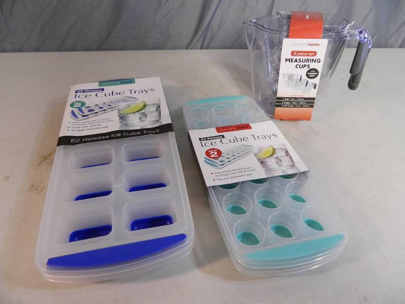 lot 98 image: New Ice Cube Trays and New Measuring Cup Set