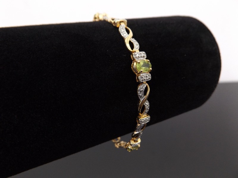 lot 56 image: .925 Sterling Silver Oval Cut Peridot Vermeil Tennis Bracelet