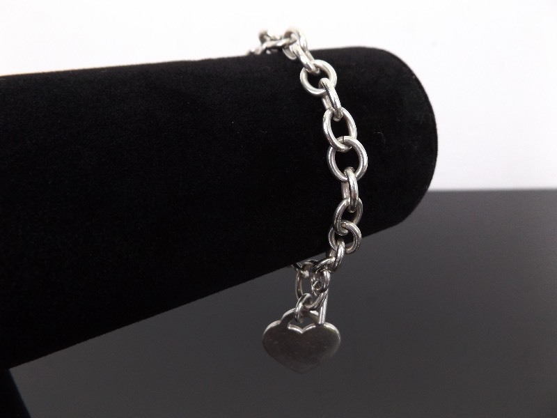 lot 61 image: .925 Sterling Silver Charm Bracelet