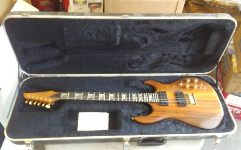 lot 37 image: Wood-Carvin Made In USA Electric Guitar With Hard Case