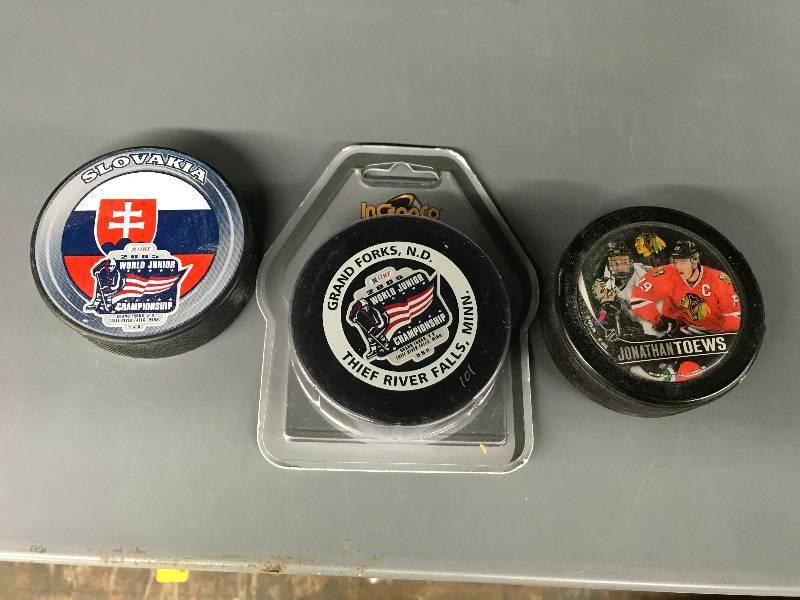 lot 246 image: Johnathan Toews Puck, World Juniors Puck, Slovakia World Juniors Puck