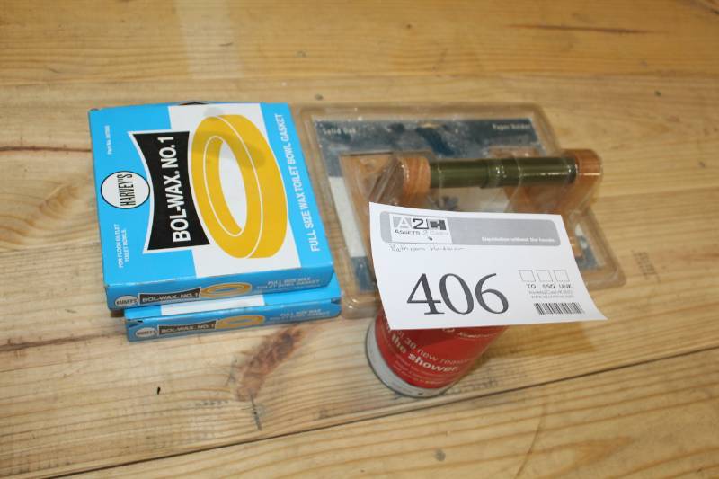 lot 406 image: Assortment of bathroom supplies, wax rings, toilet paper roll holder, shower head