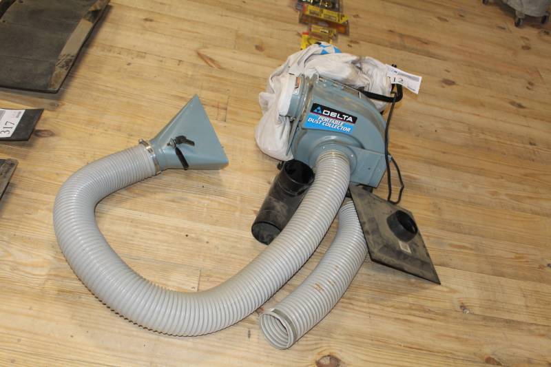 lot 312 image: Delta portable dust collector with hose and attachments. Works well.