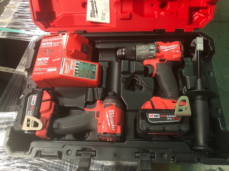 Milwaukee M18 FUEL 18-Volt Lithium-Ion Brushless Cordless Hammer Drill & Impact Driver Combo Kit (2-Tool) w(2) 5Ah Batteries in good conditions