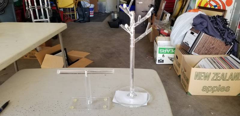 lot 25 image: Lot of (2) Clear Plastic Wrist Bracelet and Necklace Stands