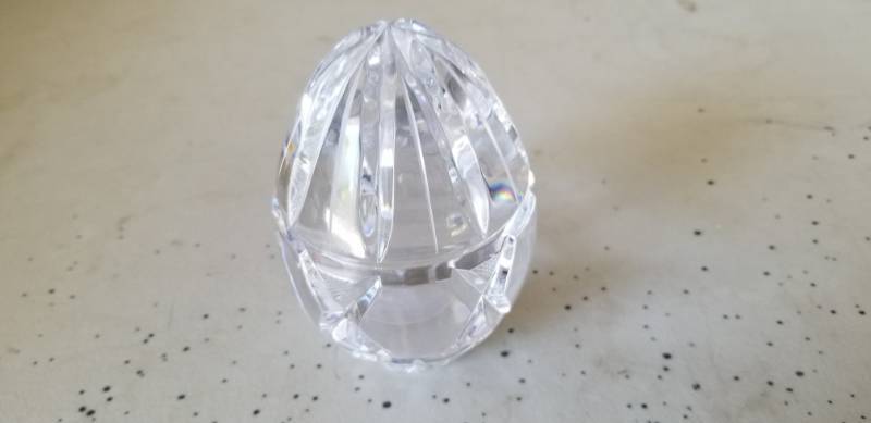 lot 26 image: Solid Crystal Glass Egg Shaped Paper Weight, Cut Pattern on Exterior