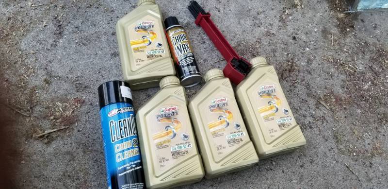 lot 42 image: Castrol Chainsaw Oil, Cleaner, Wax, Brush
