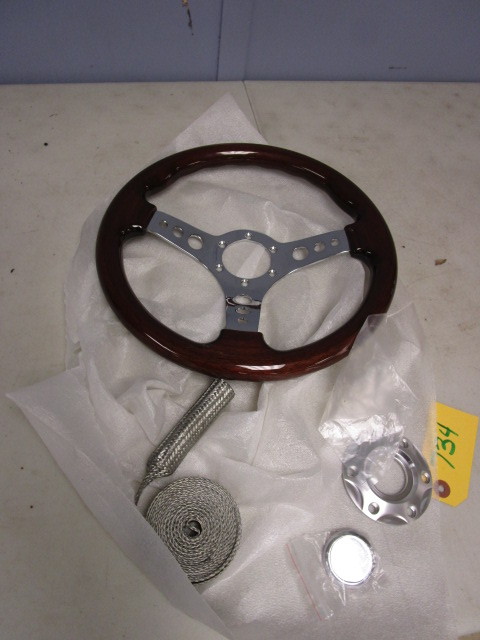 lot 734 image: NEW STEERING WHEEL