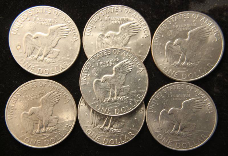 lot 39 image: GROUP OF 7 CLAD EISENHOWER DOLLARS