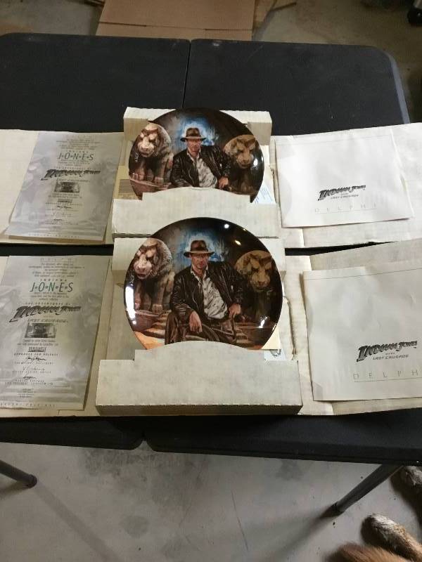 2 Indiana Jones Plates with papers and boxes.