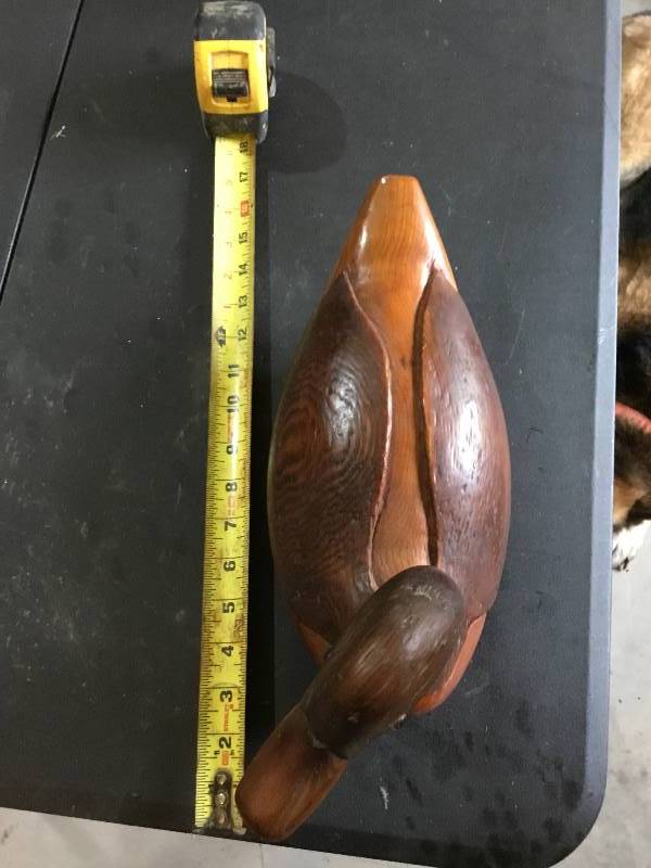 Hand carved and stained wooden duck.  About 17 long.