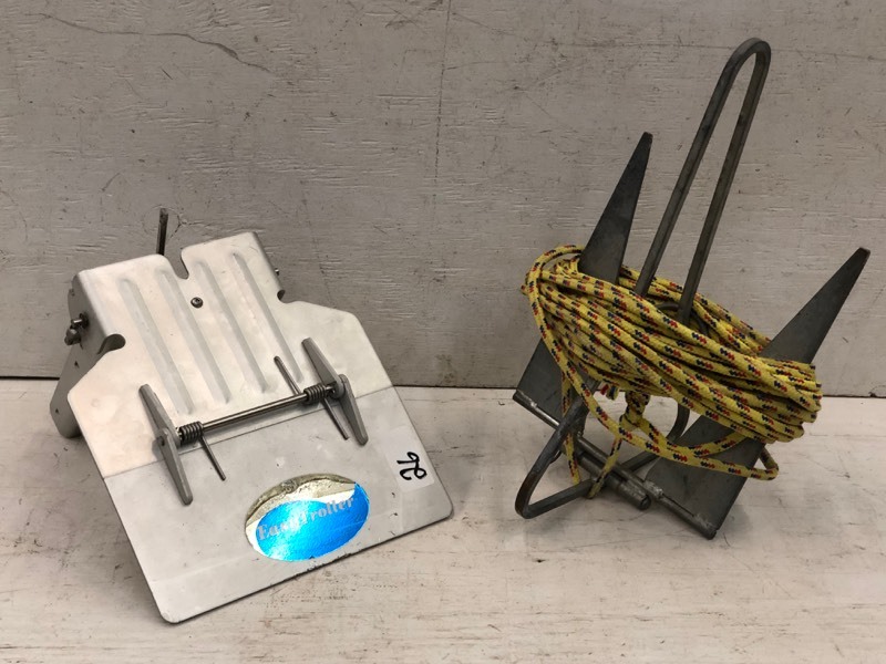 lot 26 image: (1) Boat Anchor & (1) Boat Motor Trolling Plate