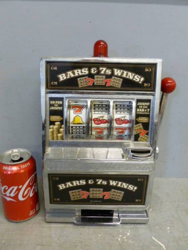 lot 230 image: Slot Machine Coin Bank