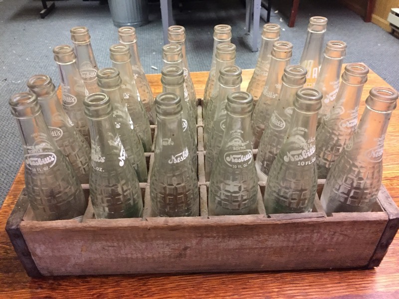 lot 32 image: Wood Tote Full of Soda Bottles