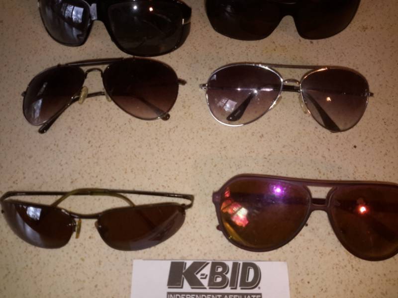 lot 167 image: 10 pair of sunglasses.. One box
