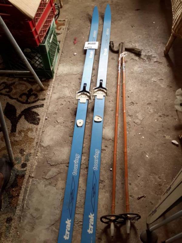 lot 134 image: Pair of Trak Cross Country Skiis and poles..