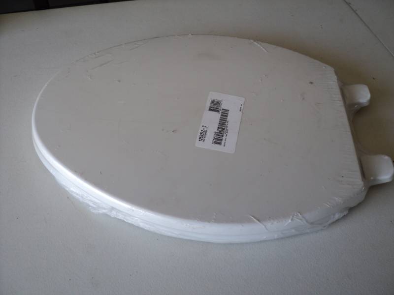 lot 27 image: Kohler White Toilet Seat- New with ...