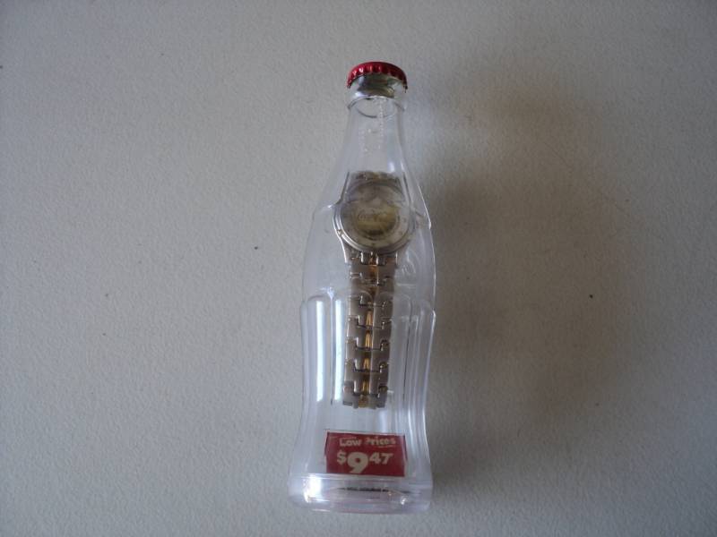 lot 36 image: Coca Cola Watch in a Bottle...