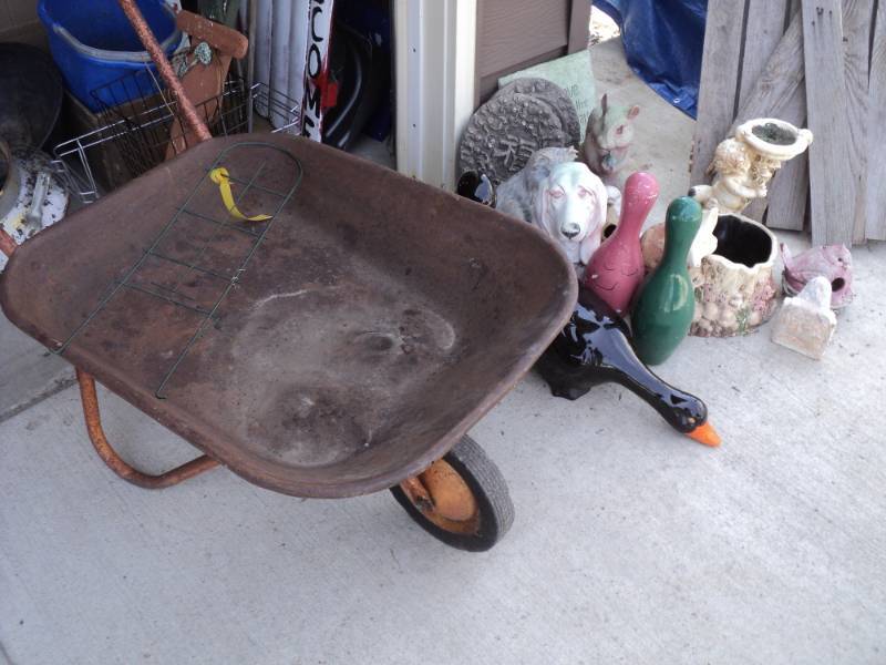 lot 47 image: Large Outdoor Dcor Lot with Wheel...