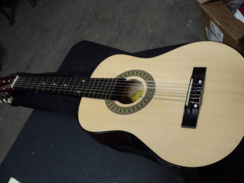 lot 192 image: Little Ly on Guitar in Case...