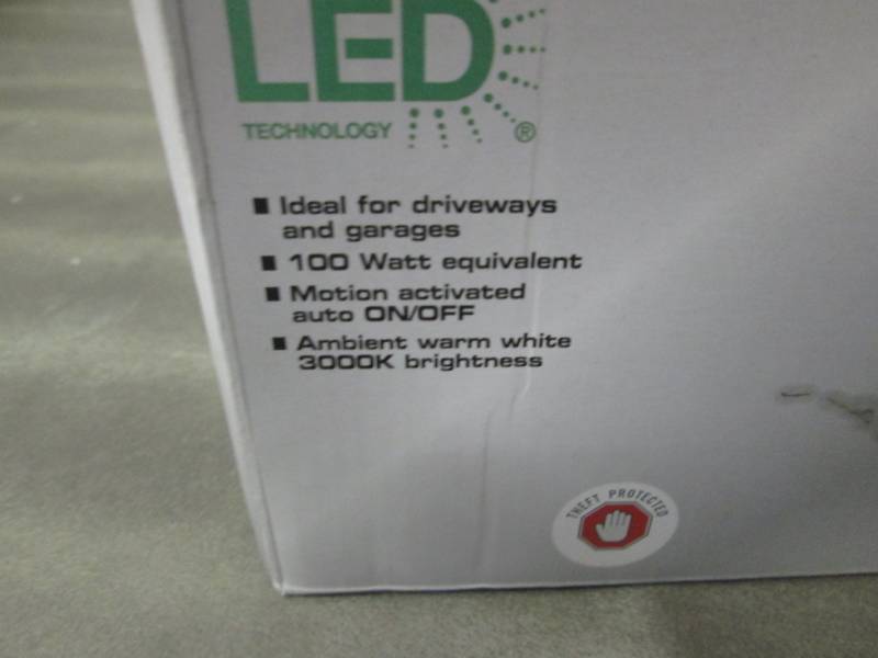 lot 419 image: Defiant 180° White Motion Activated Outdoor Integrated LED Twin Head Flood Light with Warm White Light Output open box