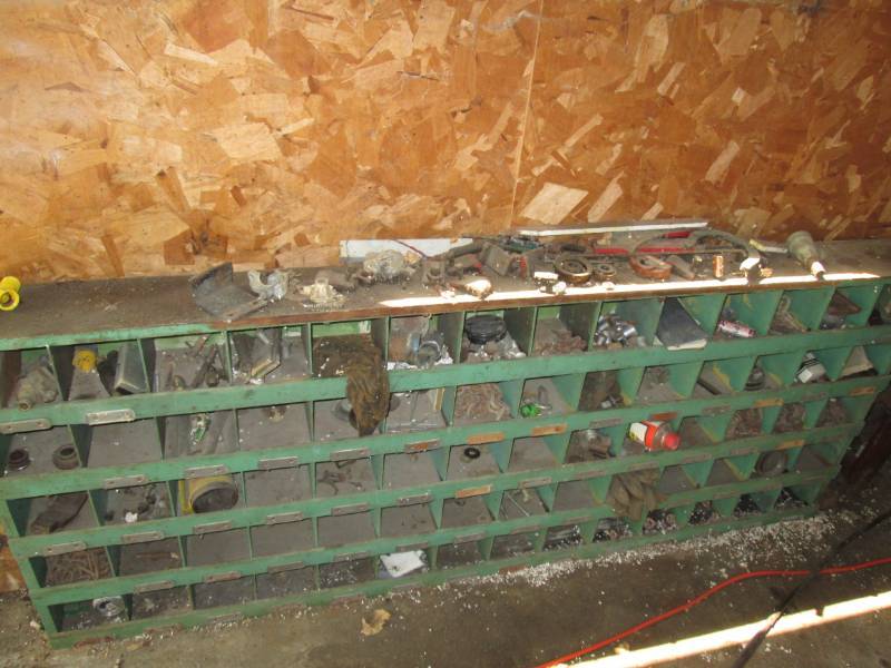 lot 92 image: Green wood cubby with Misc. tools, ...