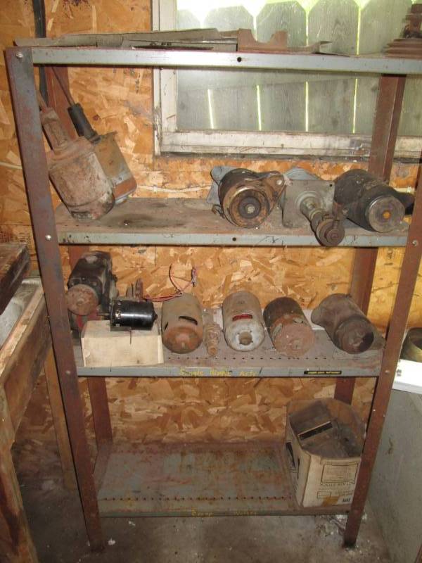 lot 101 image: Metal shelf with generators and mis...