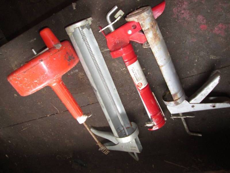lot 110 image: 3 Caulk guns, drain snake...