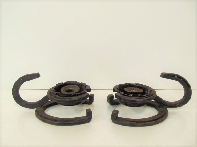 lot 229 image: 2 Antique Cast Iron Horseshoe Candle Holders