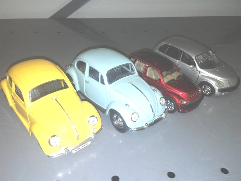 lot 280 image: 4 cars - 2 VW Beetles and to PT Cruisers, metal.