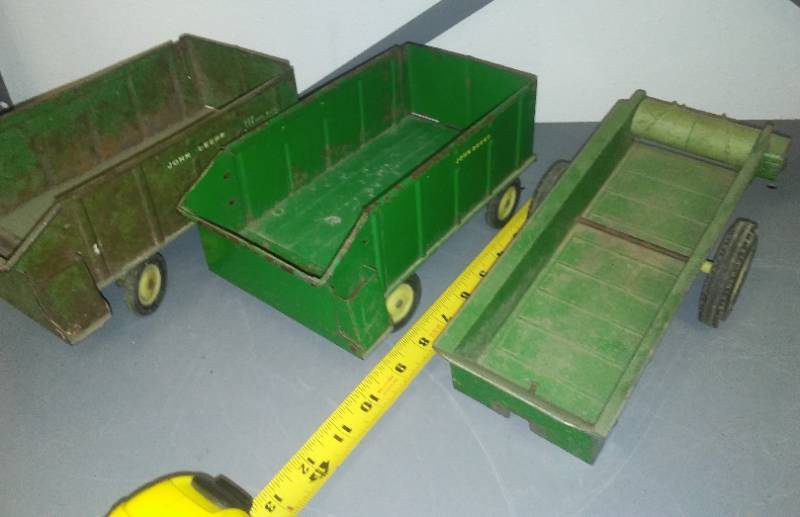 lot 337 image: John Deere Manure Spreader and two wagons metal.