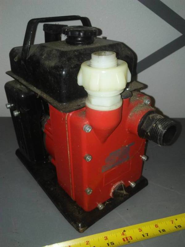 lot 417 image: Gasoline sump pump engine common NorthStar with box, pulls over easy.