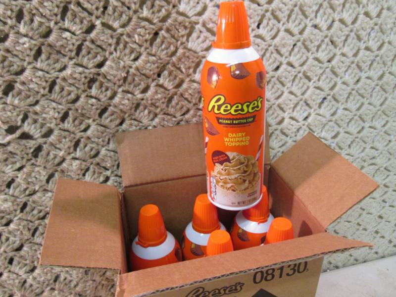 lot 174 image: Case of 6 Cans of Reeses Peanut But...