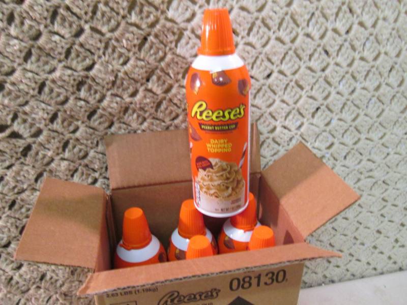 lot 175 image: Case of 6 Cans of Reeses Peanut But...