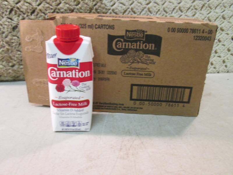 lot 209 image: Case of 8 Nestle Carnation Evaporat...