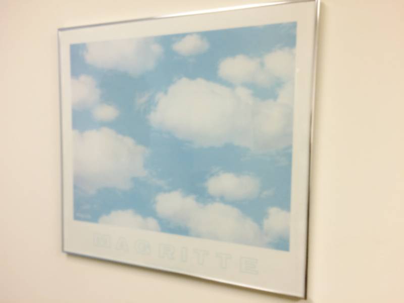 lot 55 image: Large Framed Poster Of Clouds by Artist Rene Margritte - Excellent Condition