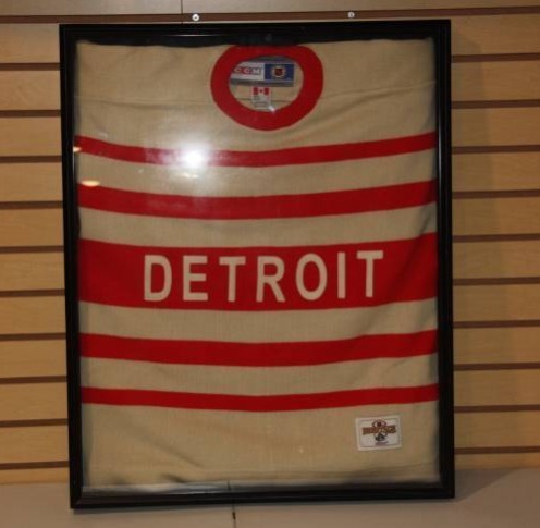 lot 53 image: CCM Heritage Detroit Red Wings Hockey Jersey in Frame