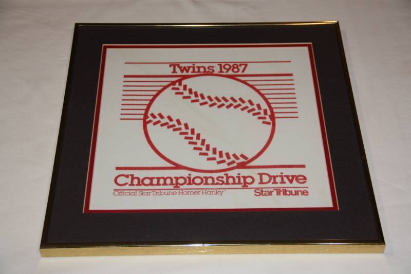 lot 58 image: Framed 1987 Minnesota Twins World Series Homer Hanky