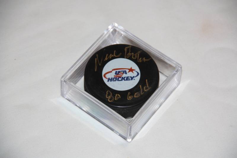 lot 67 image: Neal Broten 1980 USA Olympic Team Hockey Puck Auto