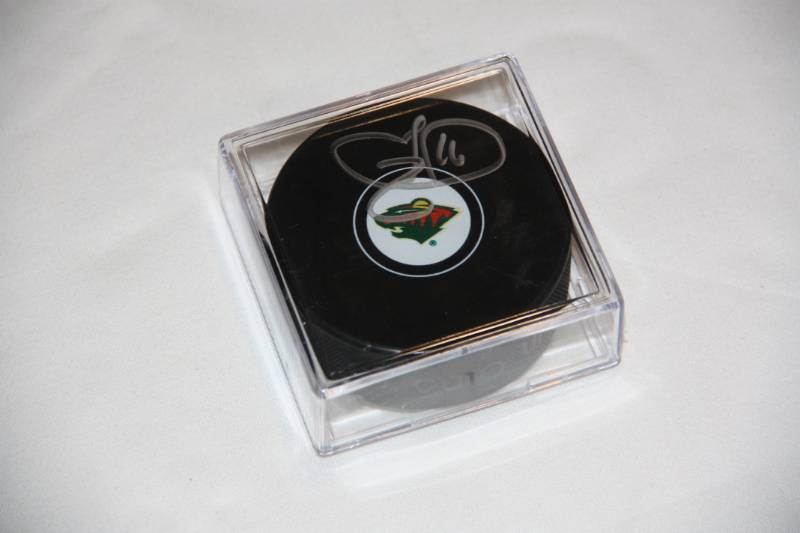 lot 68 image: Jason Zucker Minnesota Wild Hockey Puck Auto