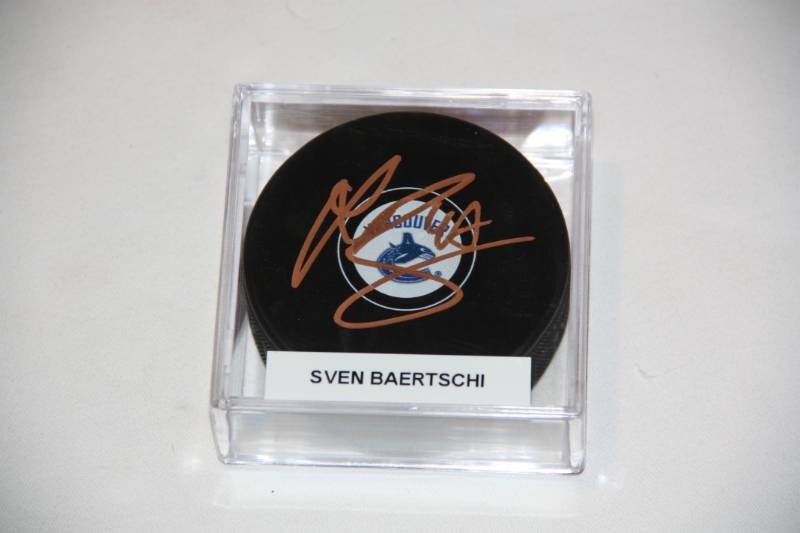 lot 91 image: Vancouver Canucks Sven Baertschi Hockey Puck Auto