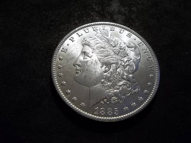 lot 24 image: 1885 O Morgan Silver Dollar