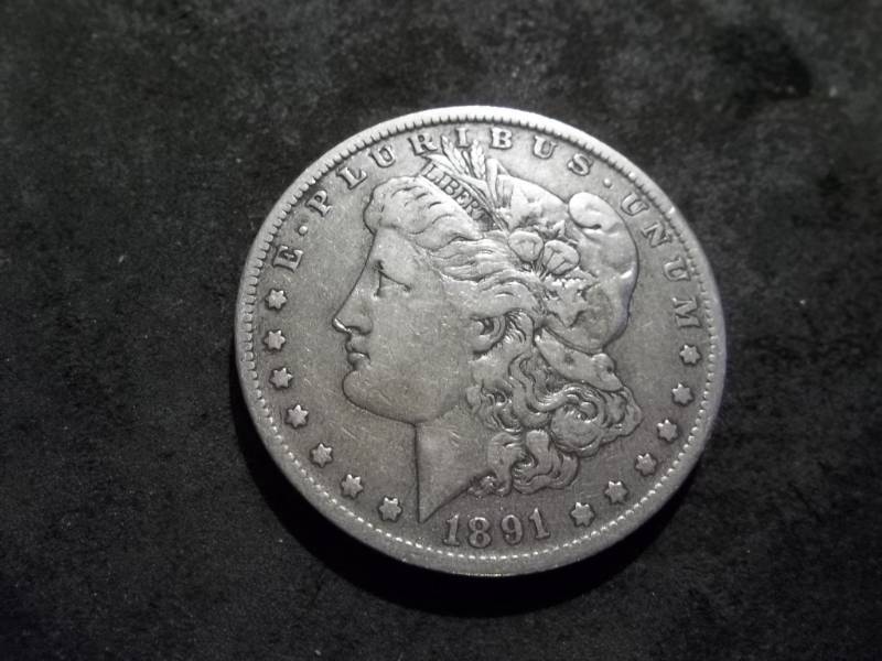lot 34 image: 1891 O Morgan Silver Dollar