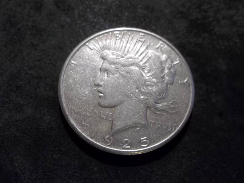 lot 54 image: 1925 S Peace Silver Dollar