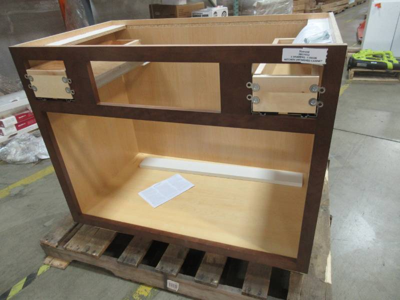 lot 27 image: Kitchen Base Cabinet, 35 12 X 21 X 32 Tall - Missing Center Drawer, Drawer faces and Doors.