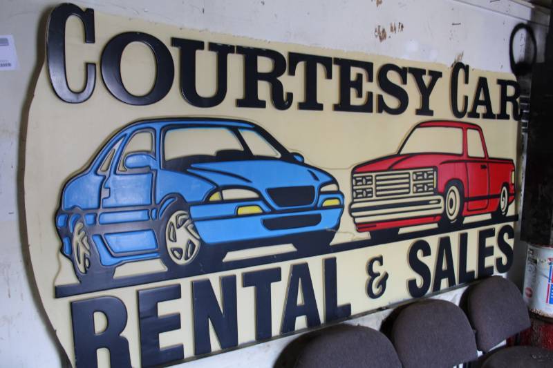 lot 190 image: Courtesy Car Rental Plastic Sign