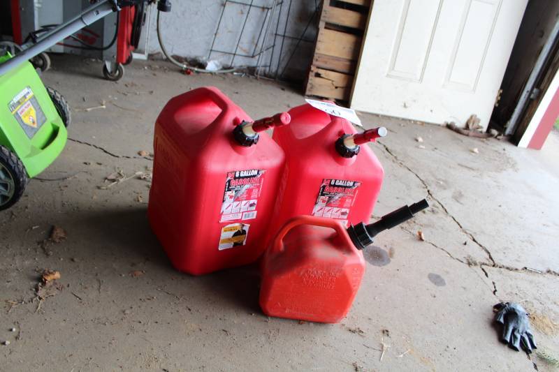 lot 160 image: Plastic 1- and 6-Gallon Gas Cans